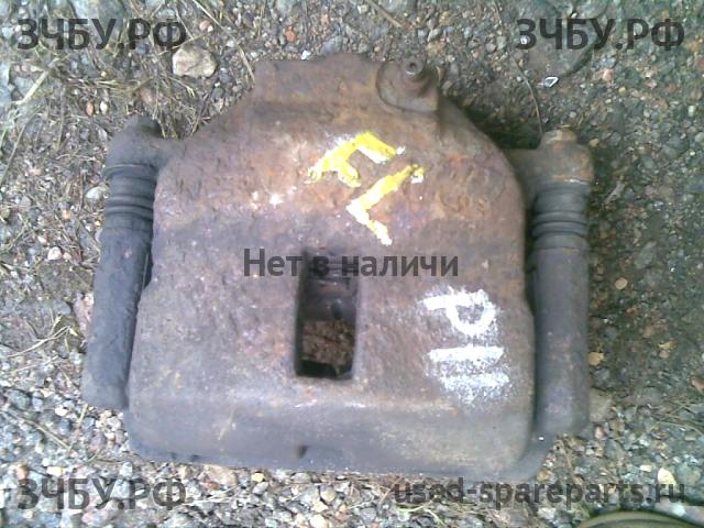 Nissan Primera P11 Суппорт передний левый (в сборе со скобой)