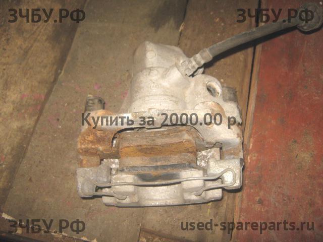 Mazda 3 [BK] Суппорт задний левый (в сборе со скобой)
