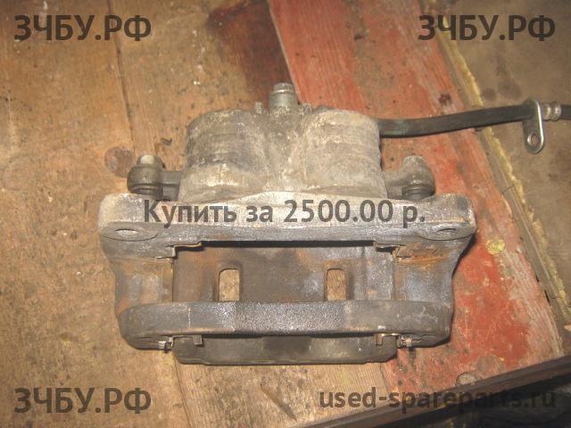 Subaru Impreza 2 (G11) Суппорт передний левый (в сборе со скобой)