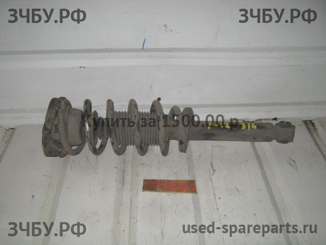 Nissan Primera P12 Стойка задняя левая (в сборе)