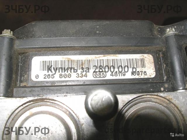 Nissan Primera P12 Блок ABS (насос)