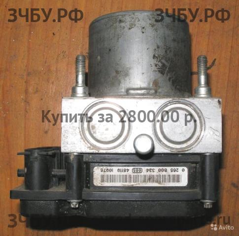 Nissan Primera P12 Блок ABS (насос)