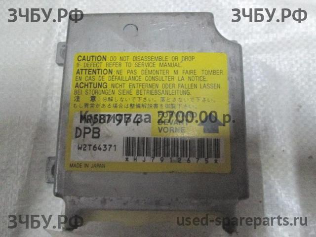 Mitsubishi L200 (4)[KB] Блок управления AirBag (блок активации SRS)