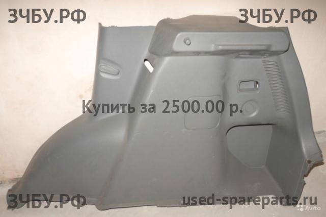 Suzuki SX4 (1) Обшивка багажника