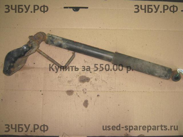Nissan NP300 1 (D40) Амортизатор задний