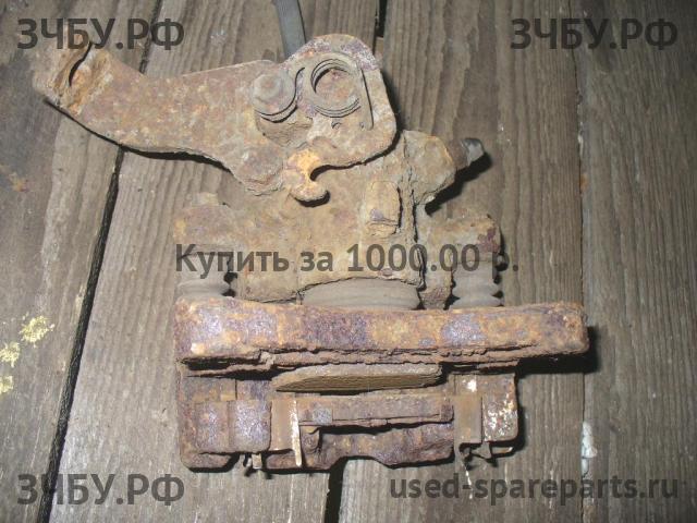Nissan Micra K11 Суппорт задний правый (в сборе со скобой)