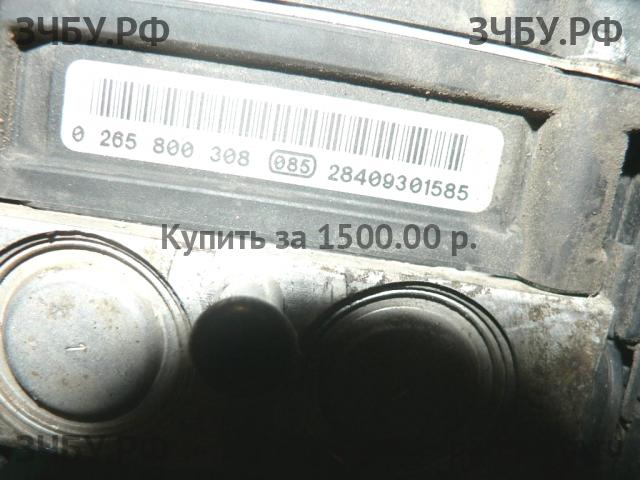 Nissan Primera P12 Блок ABS (насос)