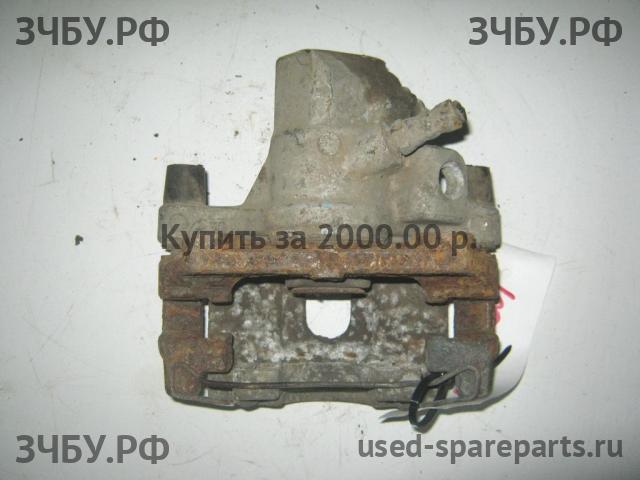 Mazda 3 [BK] Суппорт задний левый (в сборе со скобой)