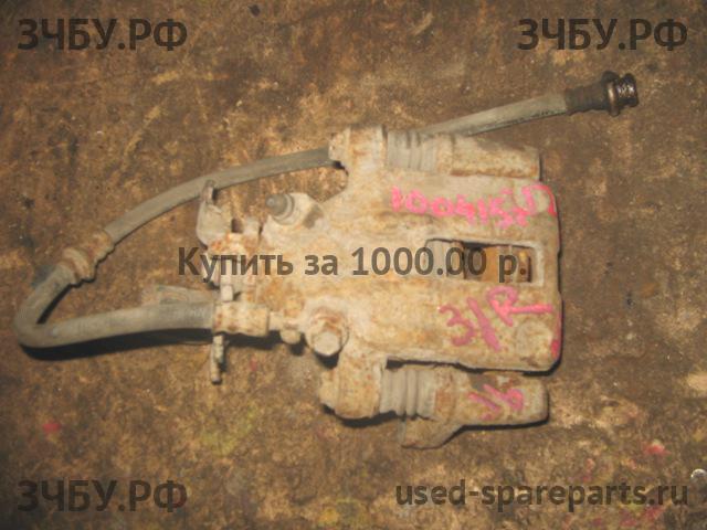 Nissan Almera 16 Суппорт задний правый (в сборе со скобой)