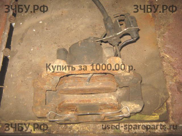 Volkswagen Passat B5 Суппорт передний левый (в сборе со скобой)