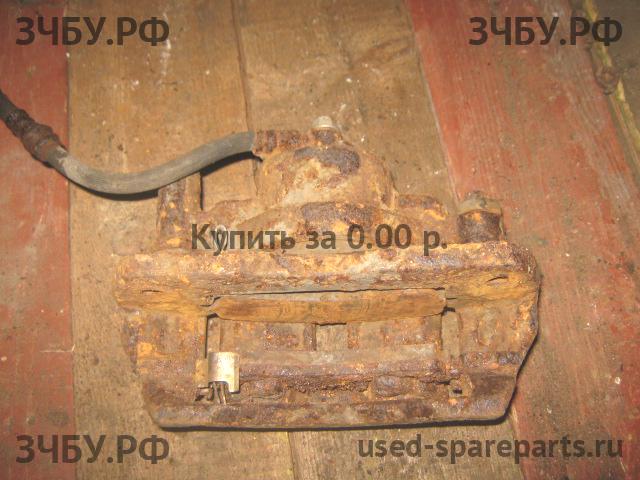 Mazda 626 [GE] Суппорт передний левый (в сборе со скобой)