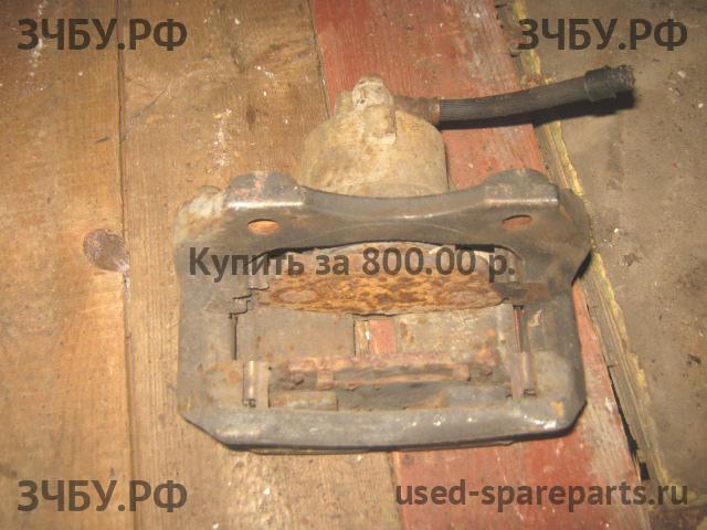 Nissan Primera P12 Суппорт передний правый (в сборе со скобой)