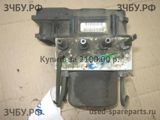 Nissan Primera P12 Блок ABS (насос)