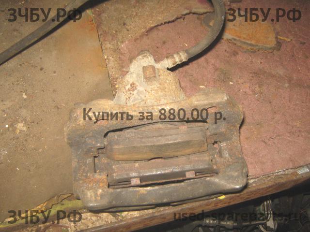 Nissan Primera P12 Суппорт передний правый (в сборе со скобой)