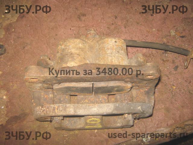 Subaru Impreza 2 (G11) Суппорт передний левый (в сборе со скобой)