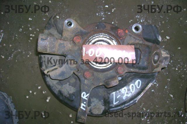 Mitsubishi L200 (4)[KB] Кулак поворотный передний правый (со ступицей)