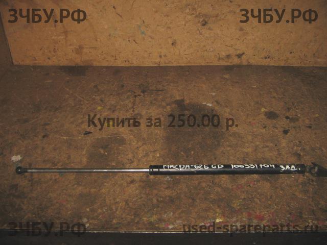 Mazda 626 [GD] Амортизатор крышки багажника