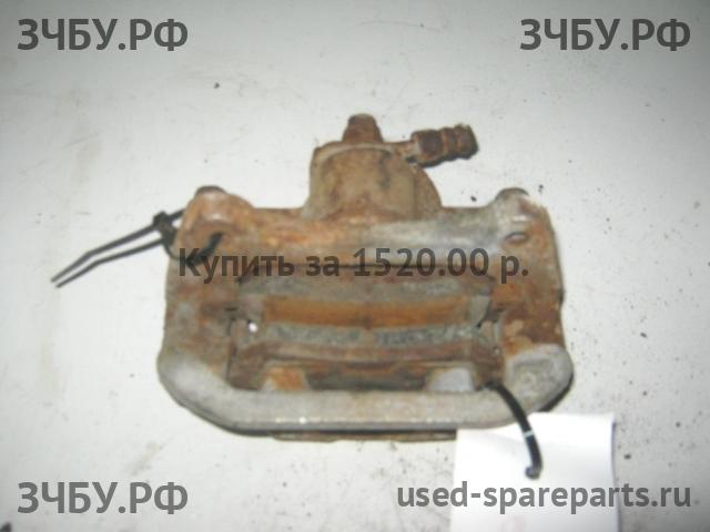 Mazda 323 [BA] Суппорт задний левый (в сборе со скобой)