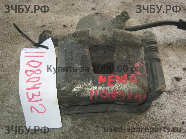 Daewoo Nexia (2008>) Суппорт передний левый (в сборе со скобой)