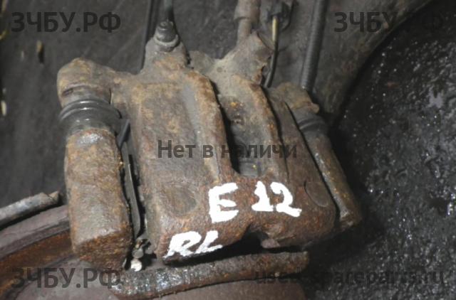 Toyota Corolla (E12) Суппорт задний левый (в сборе со скобой)