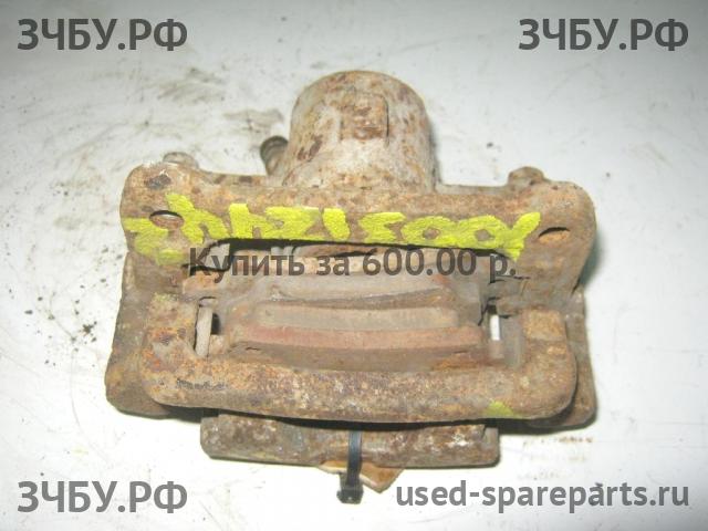 Toyota Corolla (E12) Суппорт задний правый (в сборе со скобой)