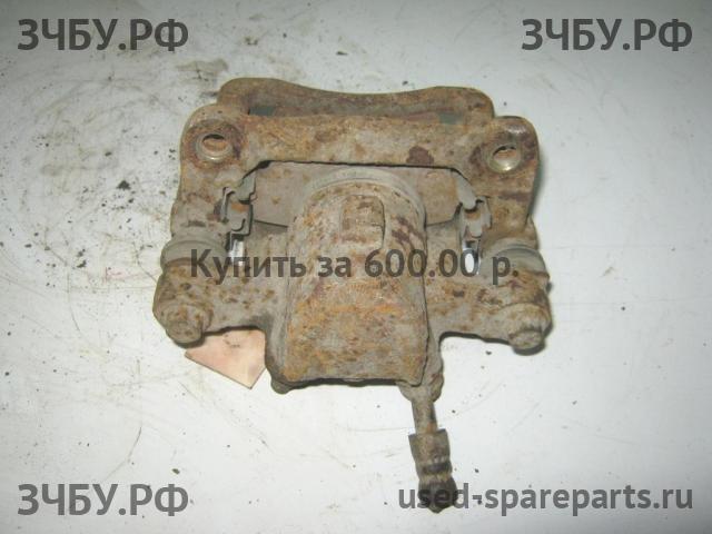 Toyota Corolla (E12) Суппорт задний правый (в сборе со скобой)