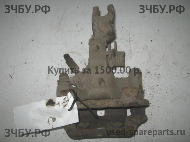 Mazda 323 [BJ] Суппорт задний правый (в сборе со скобой)