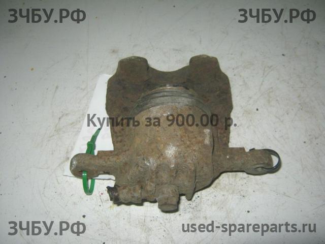Mitsubishi Carisma (DA) 2000-> Суппорт передний правый (в сборе со скобой)