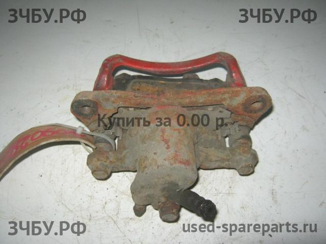 Toyota Chaser 6 (ZX 100) Суппорт задний левый (в сборе со скобой)