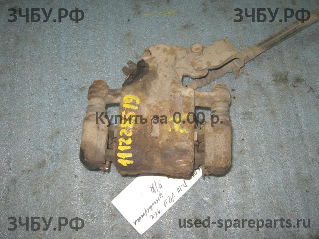 Nissan Primera P10 Суппорт задний правый (в сборе со скобой)